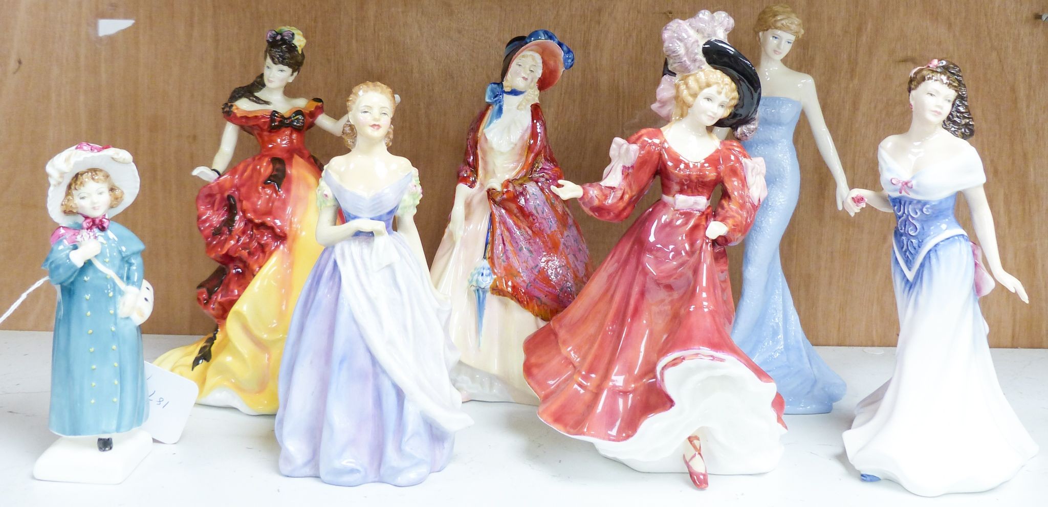 Seven Royal Doulton figurines: Carrie HN2800, Jacqueline HN2000, For You HN3754, Diana Princess of Wales HN5061, Belle HN3703, Patricia HN3365, Paisley Shawl HN1987